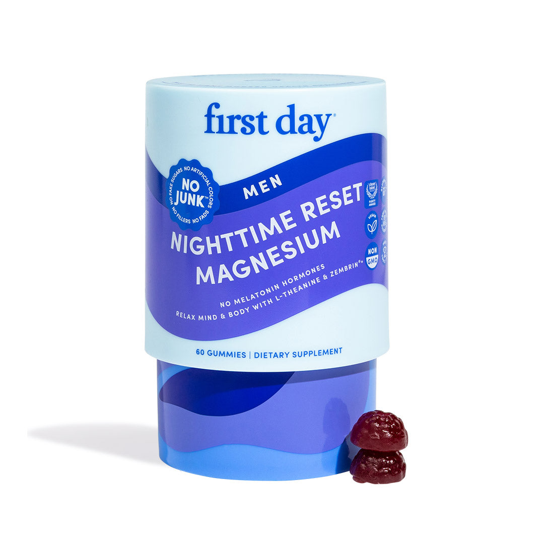 A container labeled Men’s Nighttime Reset Magnesium, with two dark red gummies in front. The blue and purple packaging notes these magnesium gummies support sleep and muscle relaxation, and contains 60 dietary supplement gummies.