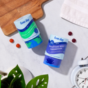 Men's Dream Team Starter Pack. This product set features two cylindrical containers of "First Day" brand dietary supplements, specifically the "Multi + Superfoods" multivitamin and the "Nighttime Reset Magnesium" gummies