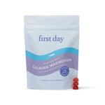 A bag of Teens’ Nighttime Reset Calming Magnesium - Free Gift For Life stands upright with two red gummies in front. The light blue and purple melatonin-free package offers a gentle sleep aid designed specifically for teens.