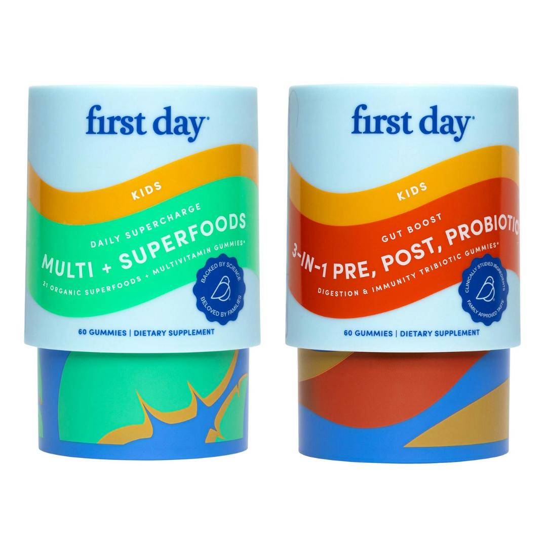 The Kids' TLC Starter Pack features two colorful cylindrical containers: one kids multivitamin with Multi + Superfoods and one probiotic, each providing 60 gummies for daily nutrition, all in bright, abstract designs.