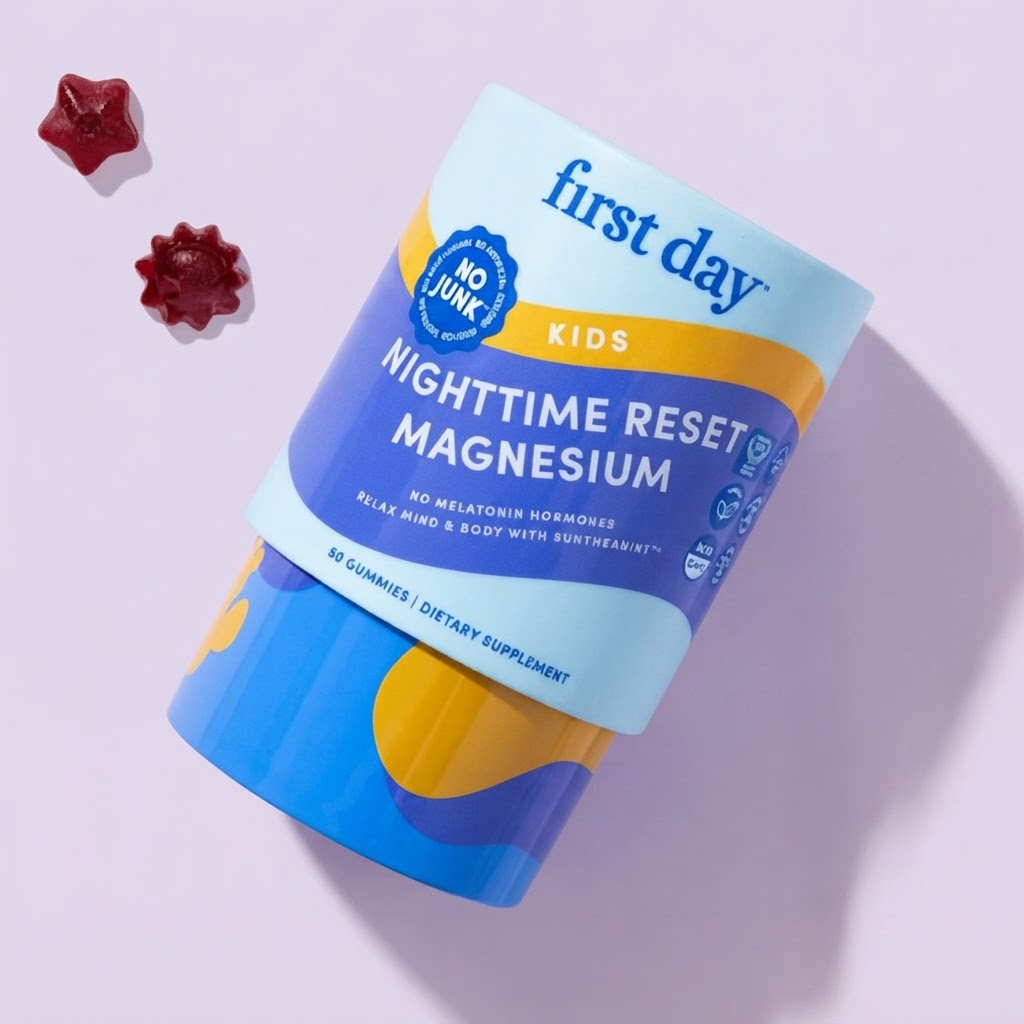 A cylindrical container of First Day Kids Nighttime Reset Magnesium gummies, shown on a light lavender background with two red star-shaped gummies placed to the left.