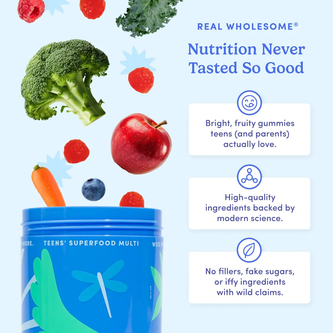 A blue canister of Real Wholesome Teens' Superfood Multi is shown on a light blue background with floating fruits and vegetables including broccoli, apple, raspberry, carrot, and blueberry. Text on the right reads 'Real Wholesome Nutrition Never Tasted So Good' with three benefit callouts.