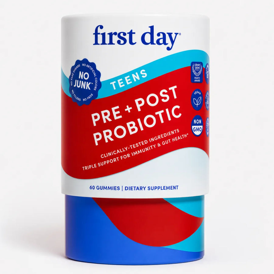 A cylindrical container of First Day Pre-Post Probiotic gummies for teens, featuring a white label with bold red and blue graphics and a blue base, set against a plain white background.